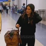 Kyla’s black leather slide sandals and brown suitcase on The Real Housewives of Beverly Hills