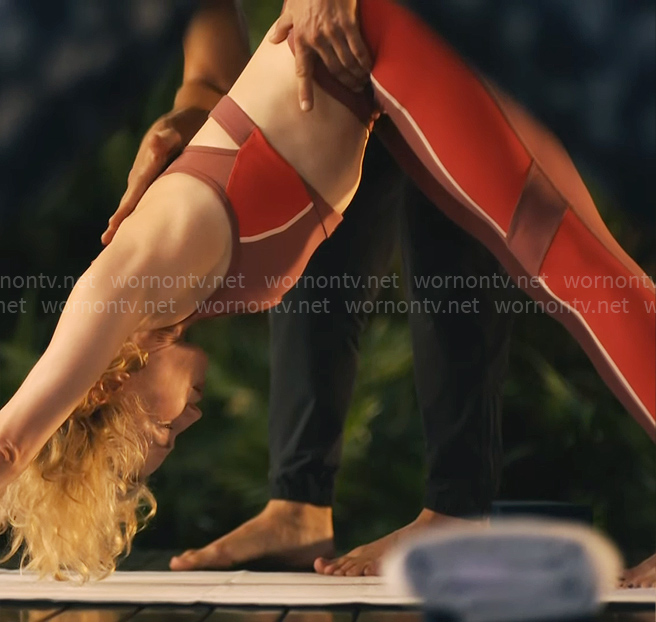 Laurie’s pink yoga outfit with red side stripes on The White Lotus