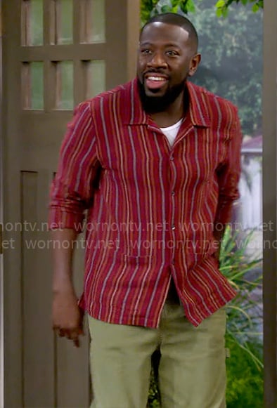 Malcolm’s red striped shirt on The Neighborhood