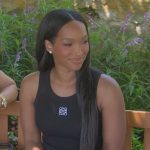 Malika Haqq’s black logo sleeveless dress on The Kardashians