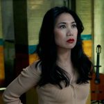 Mel’s camel off-shoulder cardigan on The Equalizer