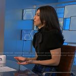 Dr. Natalie Azar’s black tie neck top and blue plaid skirt on NBC News Daily