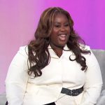 Raven Goodwin’s white contrast belted blazer on Access Hollywood