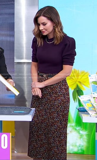 Rebecca’s purple puff sleeve sweater and print skirt on Good Morning America