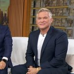 Sam Champion’s black sneakers on Good Morning America