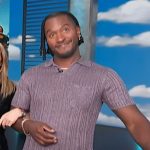 Scott’s purple knit polo on Access Hollywood