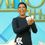Tamron’s black floral embroidered dress on Tamron Hall Show