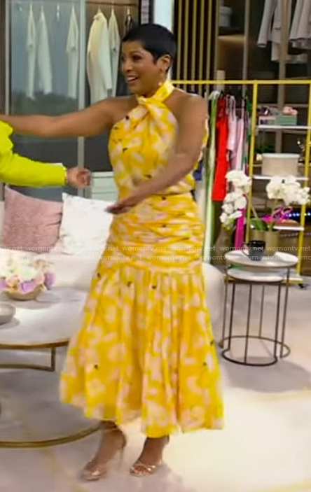 Tamron’s yellow floral print top and skirt on Tamron Hall Show