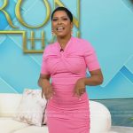 Tamron’s pink twist neck dress on Tamron Hall Show