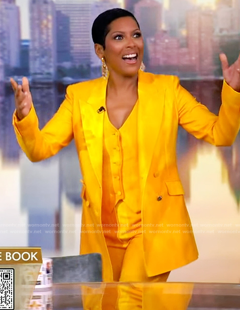 Tamron’s yellow satin suit on The View