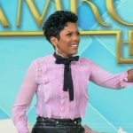 Tamron’s pink ruffle tie neck blouse on Tamron Hall Show