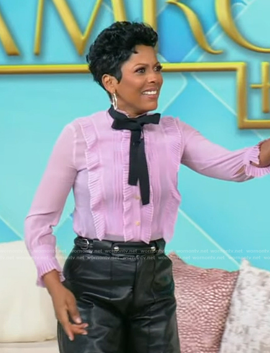 Tamron’s pink ruffle tie neck blouse on Tamron Hall Show