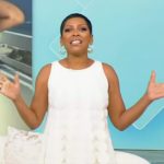 Tamron’s white scallop trim mini dress on Tamron Hall Show