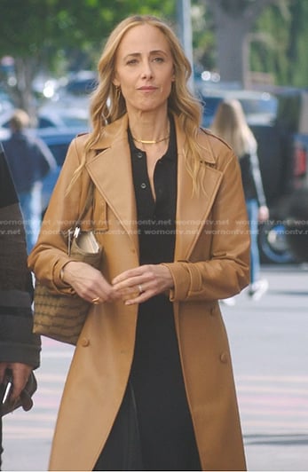 Teddy’s black draped polo dress and leather trench coat on Greys Anatomy
