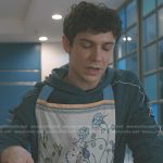 Teddy’s blue hoodie and floral apron on Elsbeth