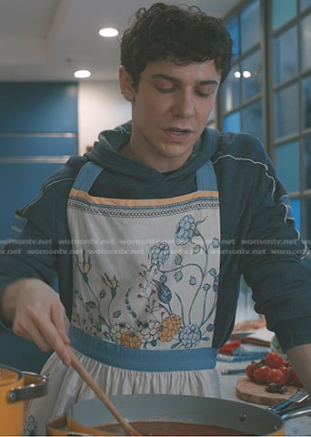Teddy’s blue hoodie and floral apron on Elsbeth