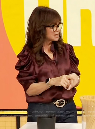 Valerie Bertinelli’s burgundy puff sleeve top on The Drew Barrymore Show
