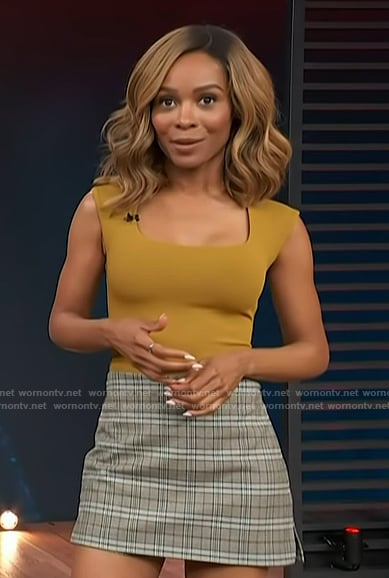 Zuri’s plaid mini skirt and bodysuit on Access Hollywood