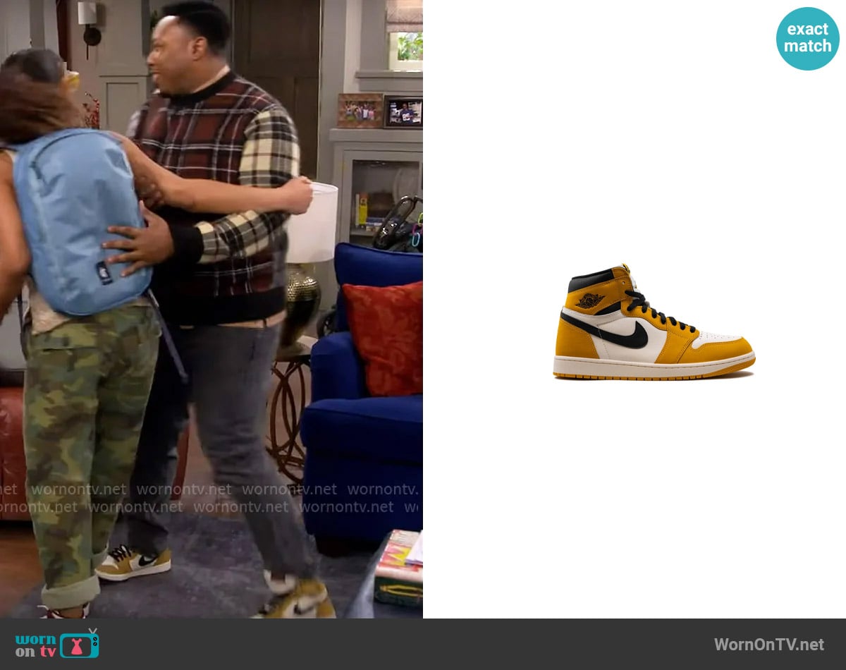 Jordan Air Jordan 1 Retro High OG Yellow Ochre sneakers worn by Marty (Marcel Spears) on The Neighborhood