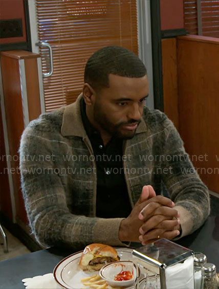 Andre’s plaid zip cardigan on Beyond the Gates