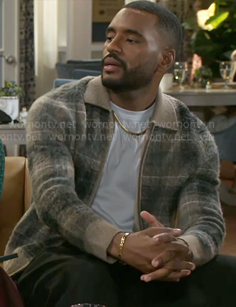 Andre’s plaid zip cardigan on Beyond the Gates