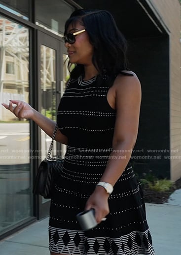 Angela’s black contrast stitch mini dress on The Real Housewives of Atlanta