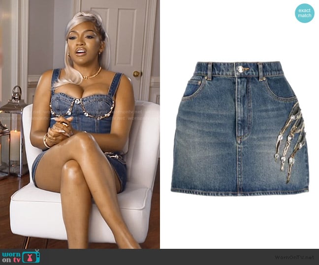 Area Claw Cut denim miniskirt worn by Drew Sidora on The Real Housewives of Atlanta