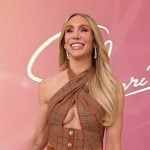 Charlotte Flair’s plaid halter top and skirt on Sherri