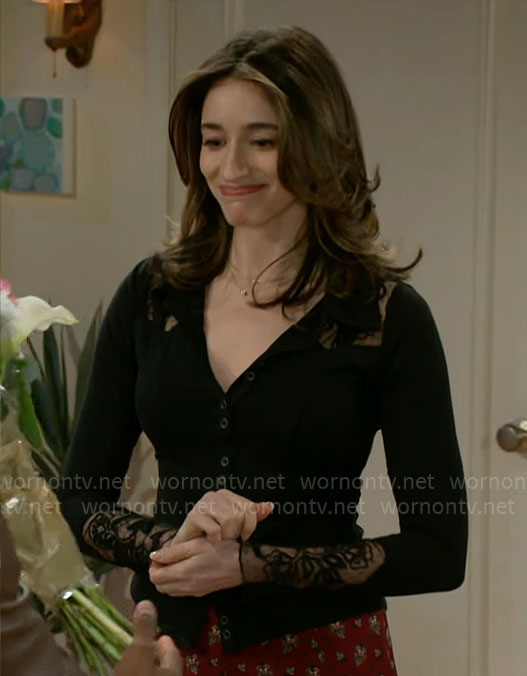 Ashley’s black lace detail top and red printed midi skirt on Beyond the Gates