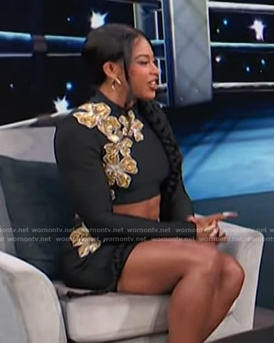 Bianca Belair’s black embellished crop top and skirt on Access Hollywood