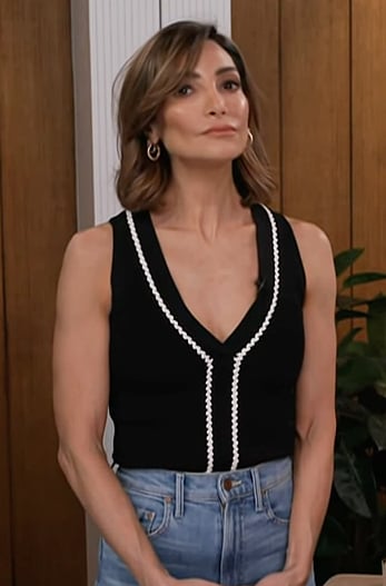 Courtney’s black contrast knit top on Access Hollywood