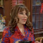 Esther’s blue and red floral blouse on The Young and the Restless