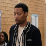 Greg’s navy stripe trim cardigan on Abbott Elementary