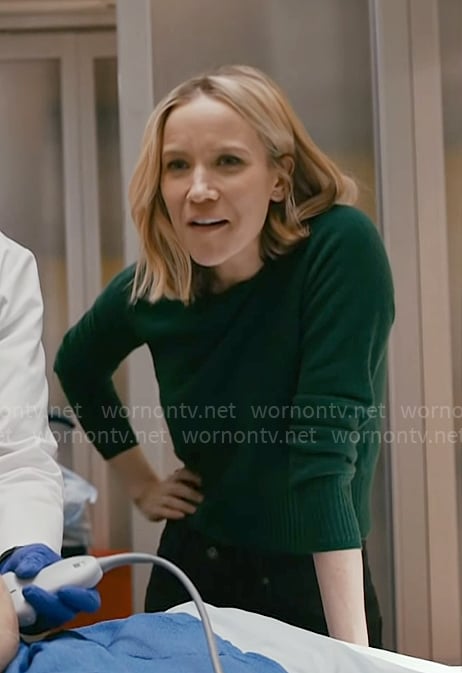 Hannah’s dark green sweater on Chicago Med