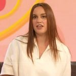 Hannah Berner’s white v-neck polo on The Drew Barrymore Show
