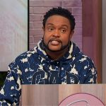 Jawn’s blue camo print embroidered hoodie on Sherri