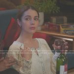Jules’ white henley top with blue stitching on Greys Anatomy