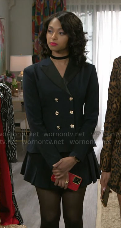 Kat’s navy blazer with open back on Beyond the Gates