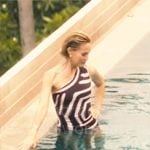 Kate’s dark purple printed one-shoulder swimsuit on The White Lotus