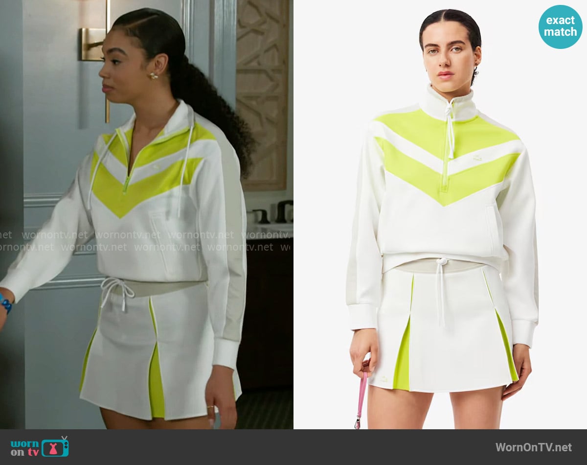 Lacoste Relaxed Fit Sweatshirt in White / Yellow / Grey worn by Chelsea Hamilton (RhonniRose Mantilla) on Beyond the Gates
