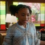 Mara’s blue plaid cardigan and pleated skirt on 9-1-1