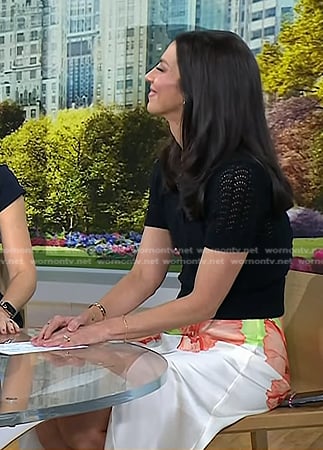 Natalie’s black pointelle polo and floral skirt on Today