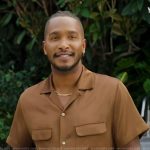 Scott’s brown utility shirt on Access Hollywood