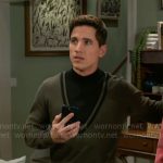 Smitty’s green and black sweater on Beyond the Gates