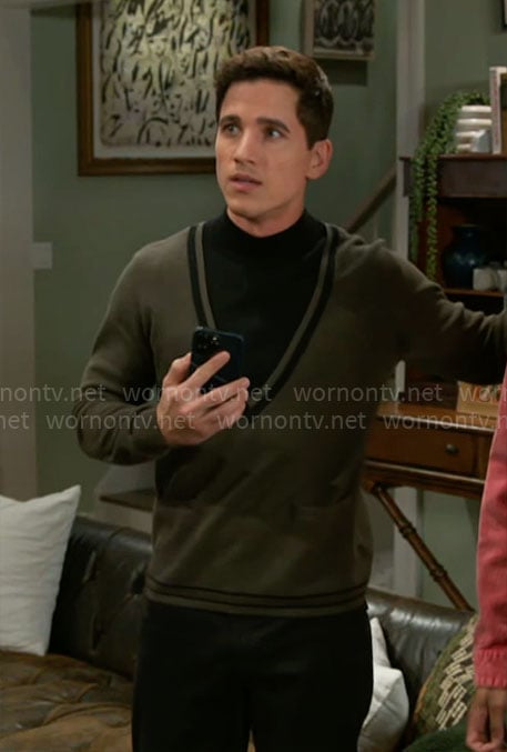Smitty’s green and black sweater on Beyond the Gates