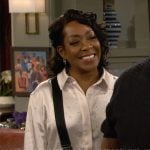 Tina’s white shirt and leopard print pants on The Neighborhood