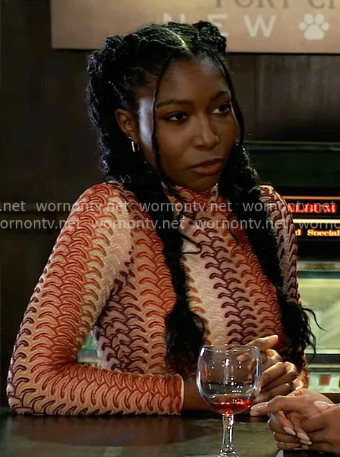 Trina’s orange patterned knit crop top on General Hospital