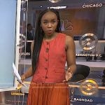 Zinhle’s pink vest and orange pleated skirt on NBC News Daily