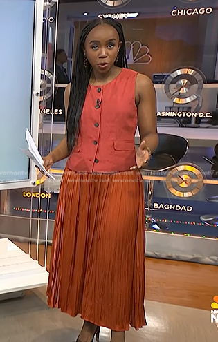 Zinhle’s pink vest and orange pleated skirt on NBC News Daily