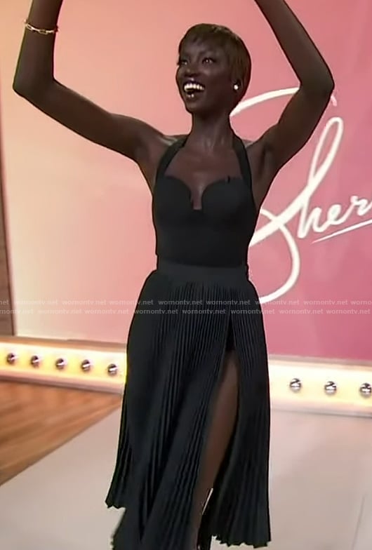 Anok Yai’s black pleated skirt and top on Sherri
